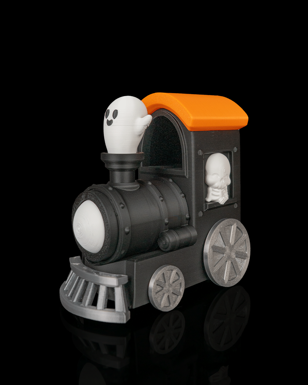 Haunted Pumpkin Train - vagon dovleac portocaliu cu fata rea pe sine negre, vedere fata, fundal negru